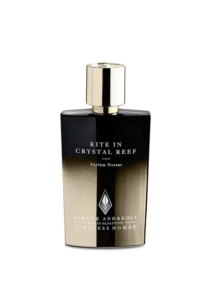 Frasco de perfume Kite in Crystal Reef de Simone Andreoli, elegante diseño negro y dorado.