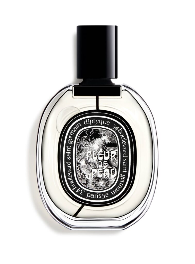 Diptyque Fleur de Peau Eau de Parfum 200 ml – frasco ovalado con etiqueta negra y detalles blancos, fragancia empolvada de almizcle.